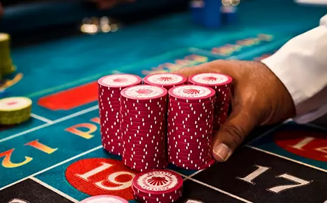 casino-overview-chips-mans-hand-house.jpg